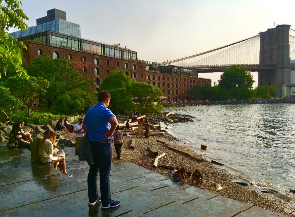 From Pebble Beach, you get glimpses of two shoreline icons, Empire Stores and the Brooklyn Bridge. Eagle photo by Lore Croghan