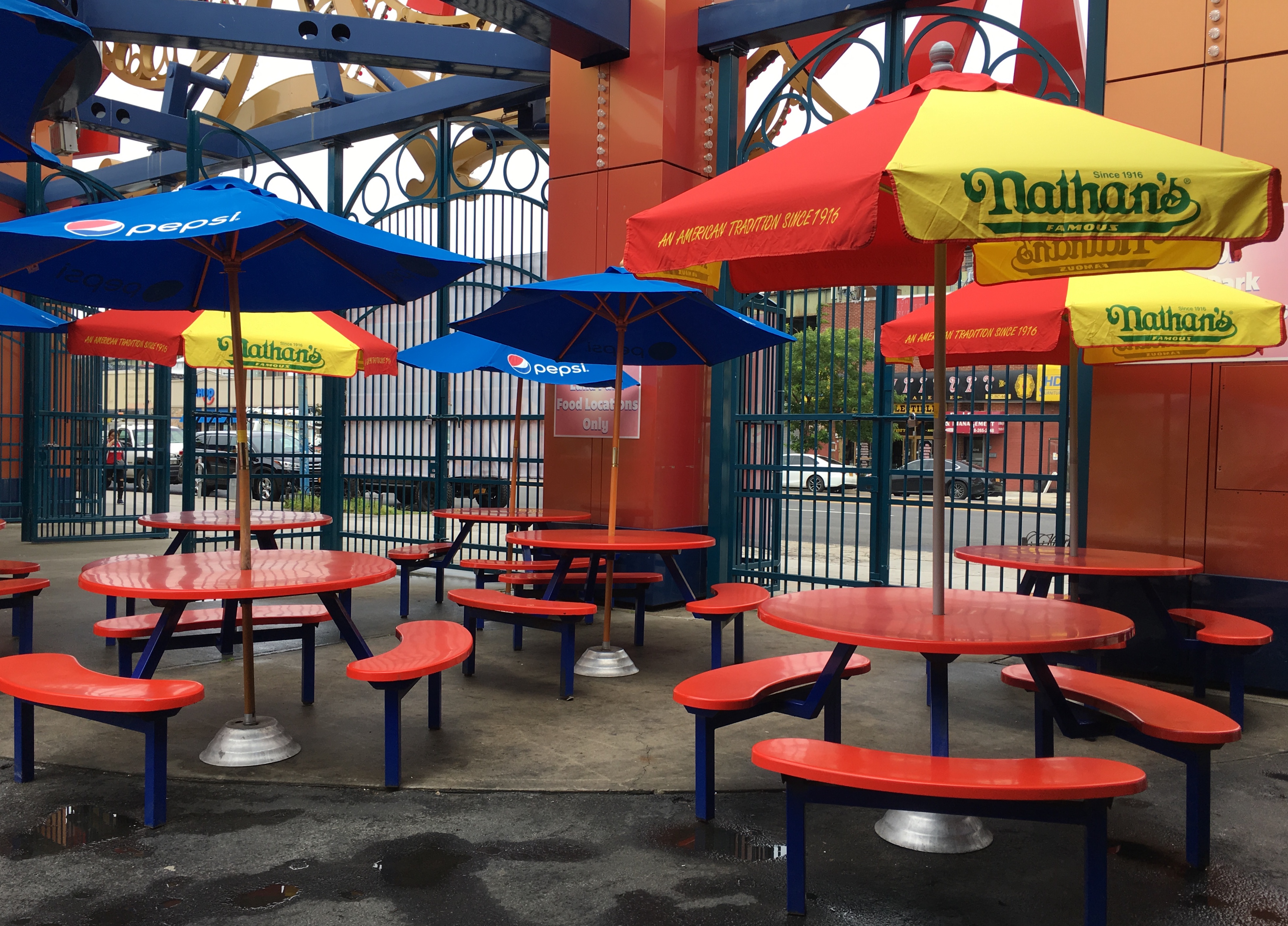 Nathan’s umbrellas shade the seating outside the former Feltman’s of Coney Island hot-dog stand. Eagle photo by Lore Croghan