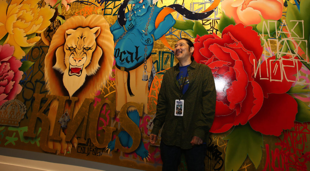 Gajin Fujita shows off his artwork. "The colors here in Brooklyn are so vivid," he said. Eagle photo by Andy Katz