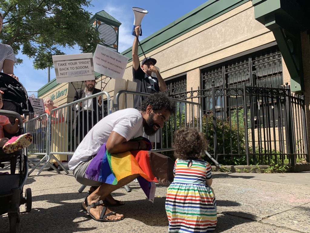 A crowd of parents bringing their children to Drag Queen Story Hour at a Crown Heights library faced a small group of protestors in the second (and smaller) demonstration against the event.