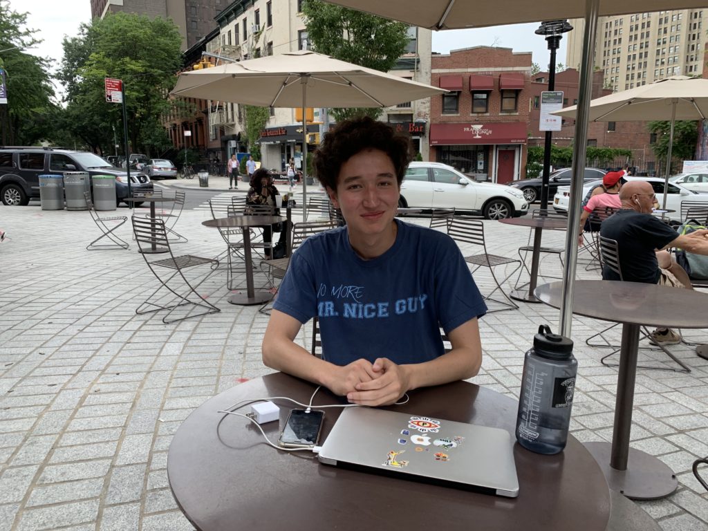 Hyunwoo Ward is from Chicago, but is visiting New York, waiting for his friend to finish work at a nearby cafe. Eagle photo by Noah Goldberg