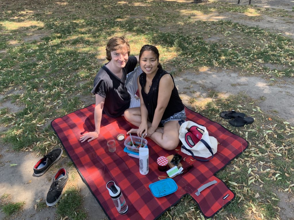 Olivia and Charles picnic. Eagle photo by Noah Goldberg