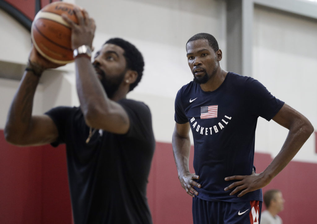 Kyrie Irving (foreground) and Kevin Durant could both be in Brooklyn this summer if Nets general manager Sean Marks can convince both to sign here as free agents over the next two weeks. (AP Photo/John Locher)
