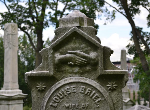 A gravestone with strange symbols on it at Green-Wood Cemetery. Photo by Stacy Locke