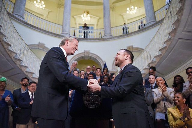 Mayor Bill de Blasio and New York City Council Speaker Corey Johnson shake hands on the 2020 budget, announced ahead of schedule on Friday. Photo by Ed Reed/Mayoral Photography Office