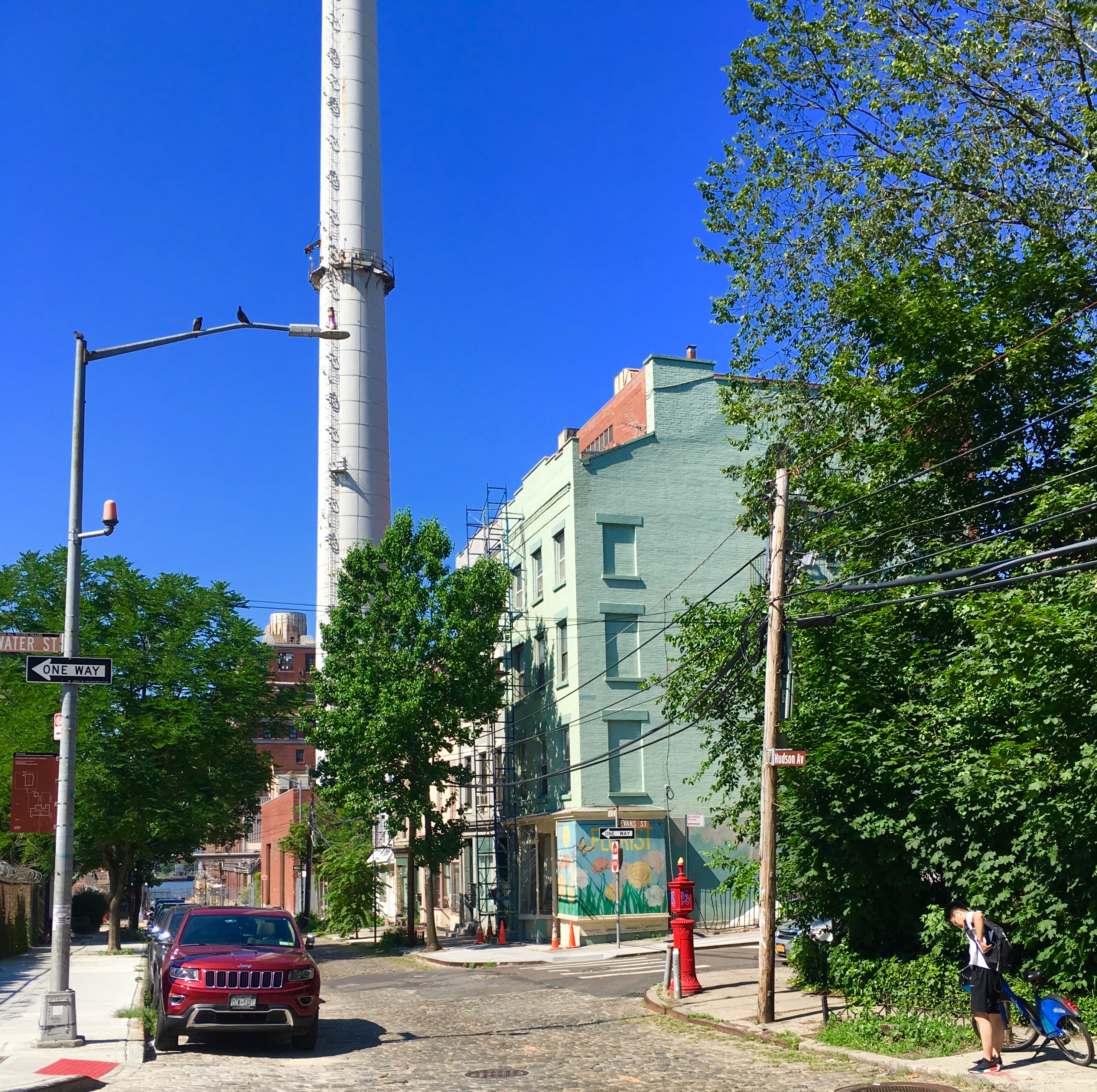 These Hudson Avenue rowhouses are located so close to Con Ed’s smokestack. Eagle photo by Lore Croghan
