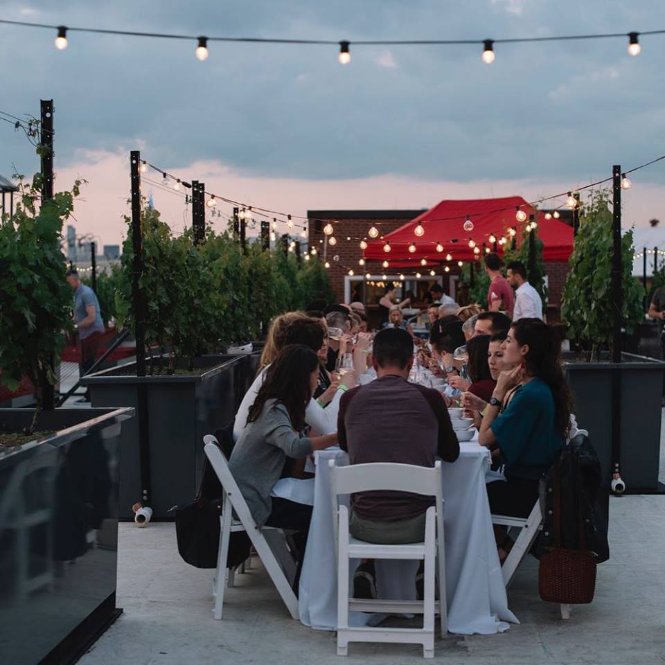Patrons enjoy dinner on the terrace of Rooftop Reds. Photo courtesy of Rooftop Reds