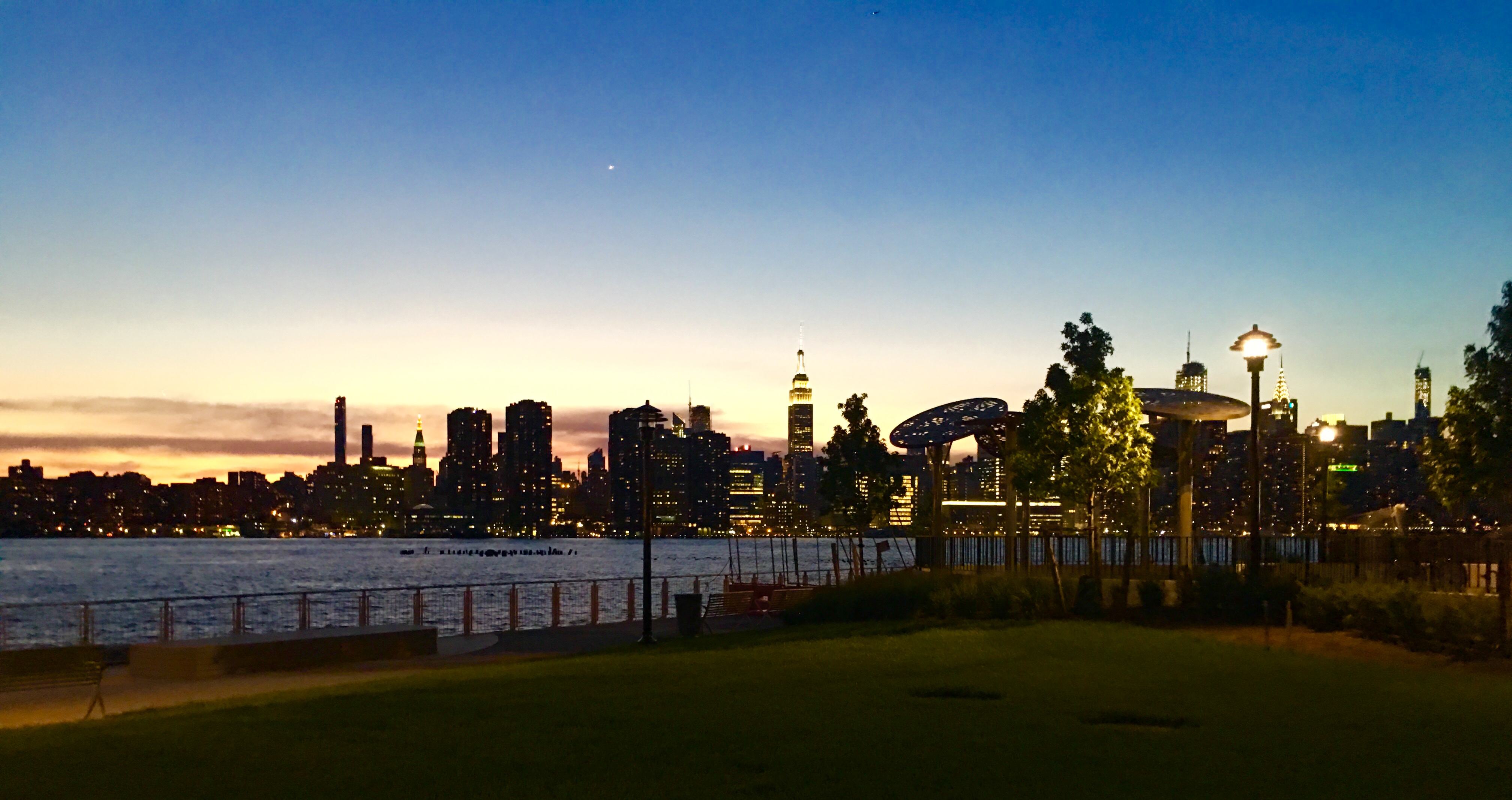 The twilight’s so serene at the new public waterfront space outside The Greenpoint. Eagle photo by Lore Croghan