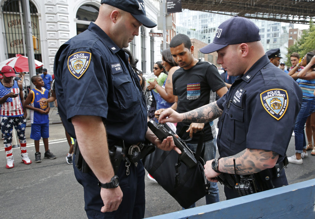 Police check bags on Fourth of July 2016. AP Photo/Kathy Willens