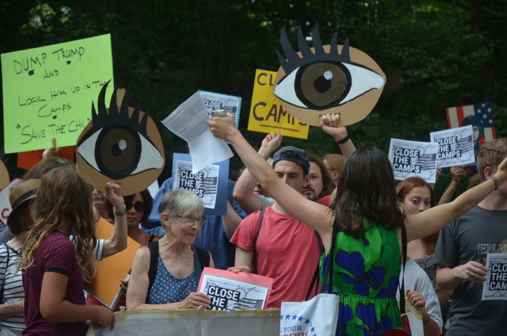 Protesters outside Sen. Chuck Schumer's home. Eagle photo by Kevin Limiti