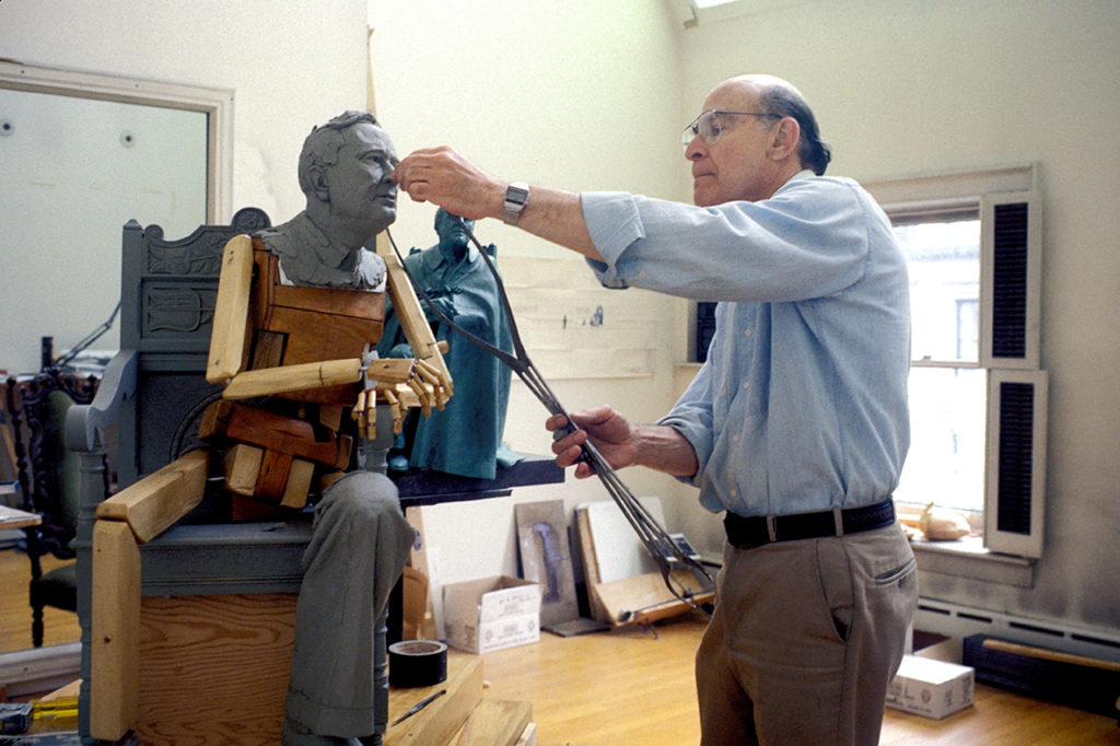 In his Brooklyn Heights art studio, sculptor Neil Estern creates a model of his famous sculpture of Franklin Delano Roosevelt. From the book, "Shaping a President: Sculpting for the Roosevelt Memorial." Photo courtesy of Diane Smook