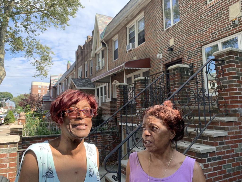 Milicent Sylvester (left) and her neighbor, Elsa, spent Sunday night in sweltering heat in Flatlands after power went out on their block. Eagle photo by Noah Goldberg
