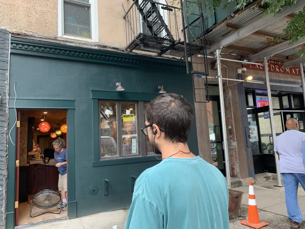 Liam O'Brien looks at his new bar. He believes they will have to delay the bar's opening due to water damage to the floors. Eagle photo by Noah Goldberg