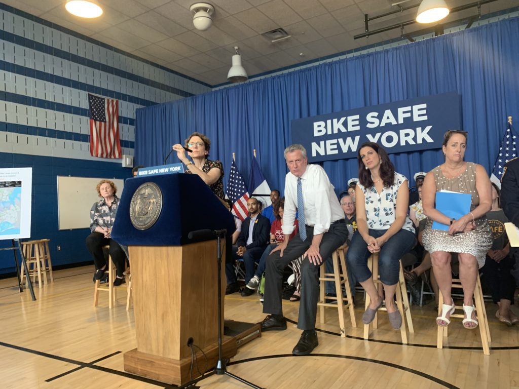 Department of Transportation Commissioner Polly Trottenberg (left) and Mayor Bill de Blasio (right) at a press conference for the administration's new "Green Wave" bike safety plan. Eagle photo by Noah Goldberg