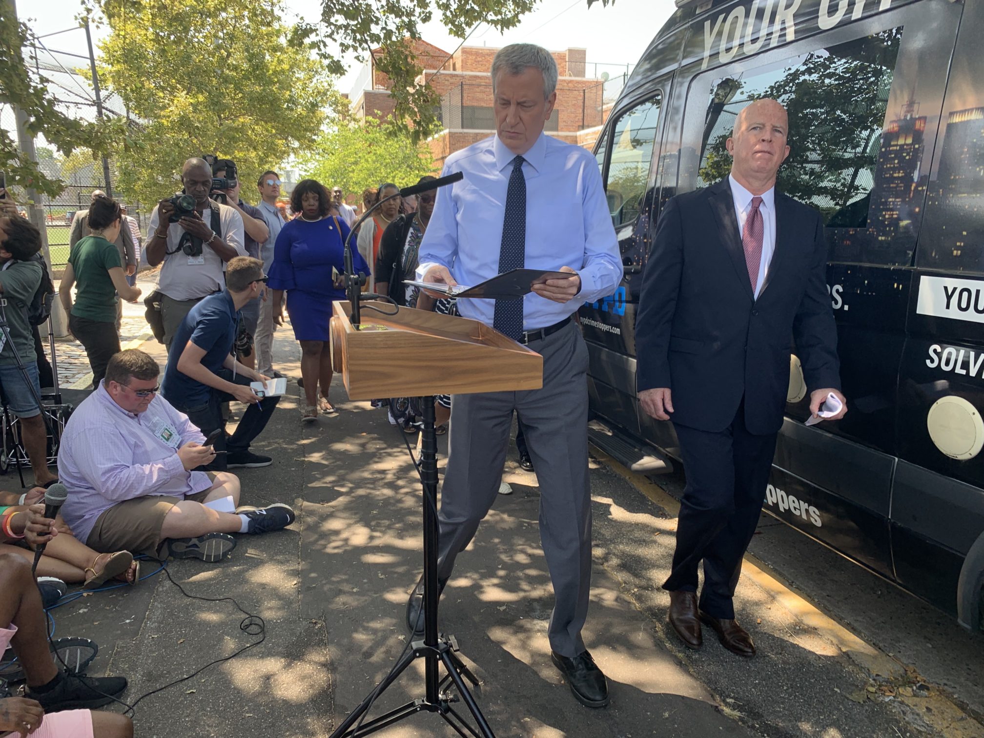 Mayor Bill de Blasio (left) and NYPD Commissioner James P. O'Neill (right) arrive July 28, 2019 to address reporters after a mass shooting in Brownsville. Eagle photo by Noah Goldberg