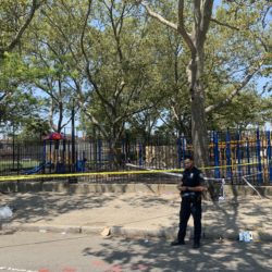 Police taped off the playground where one or more shooters shot twelve people — killing one — at a n annual block party in Brownsville. Eagle photo by Noah Goldberg