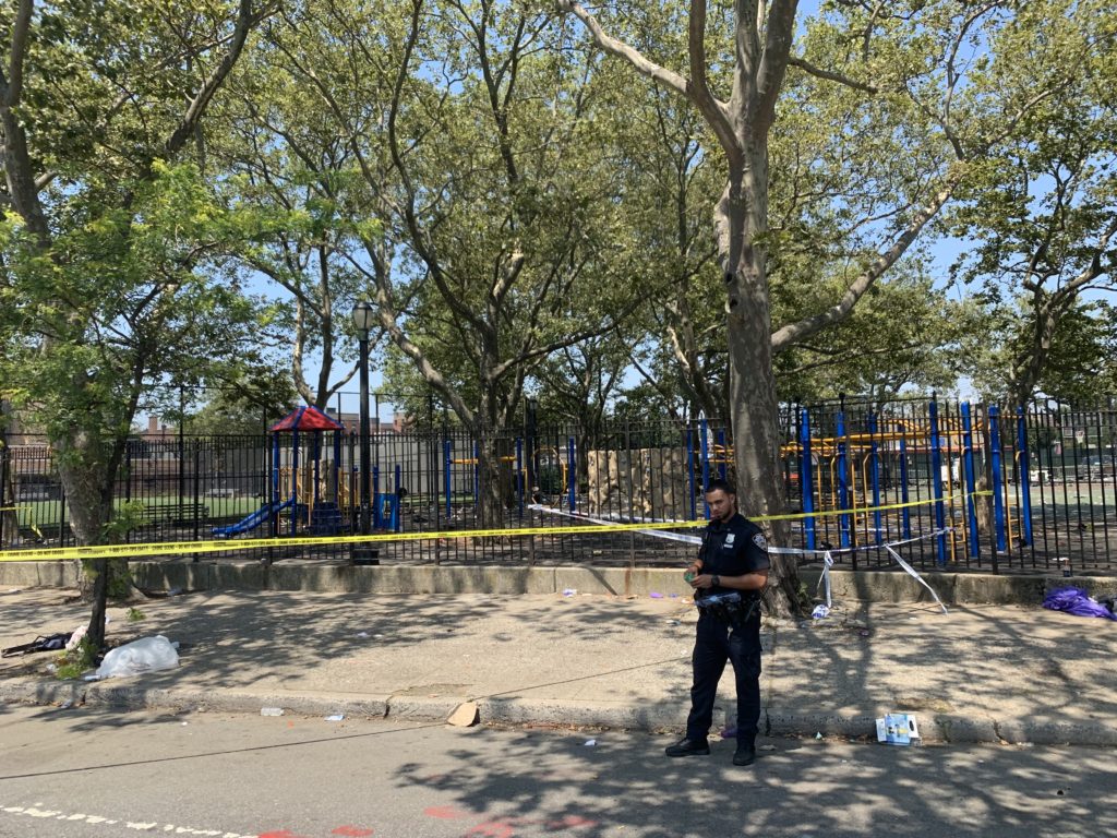 Police taped off the playground where one or more shooters shot twelve people — killing one — at a n annual block party in Brownsville. Eagle photo by Noah Goldberg