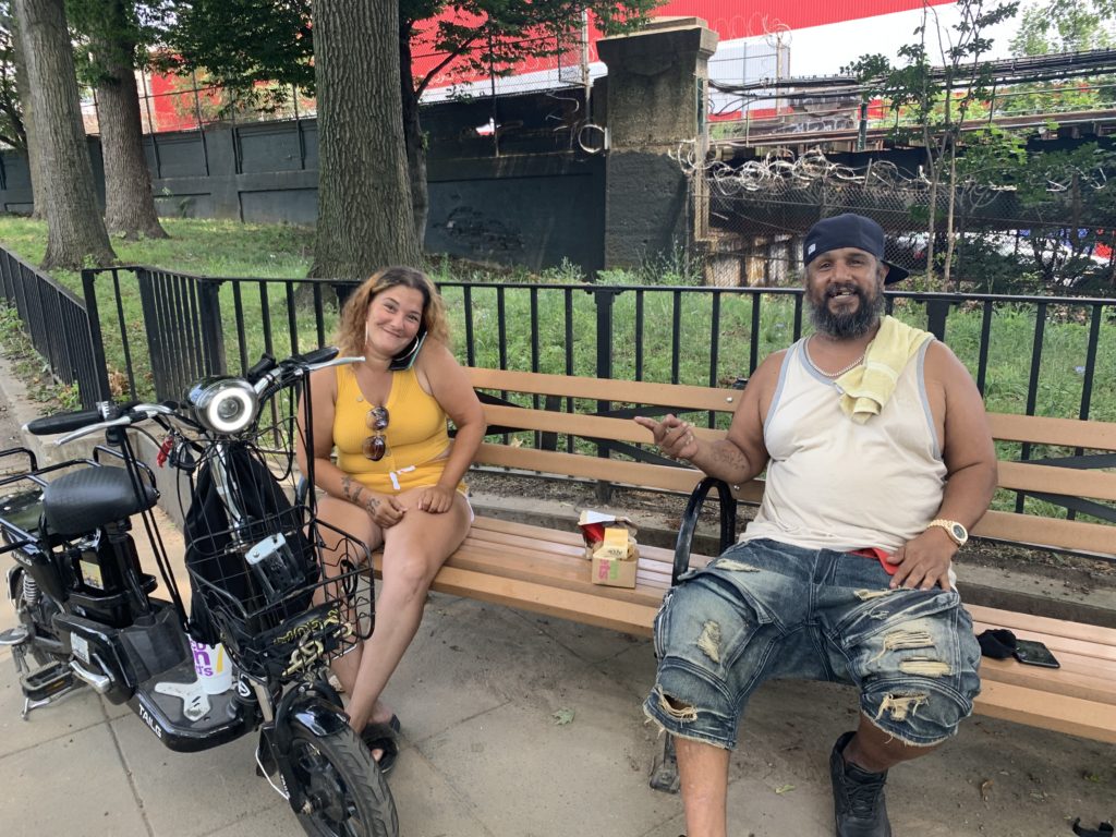 Mike Torres and his sister sit in the park Sunday. Eagle photo by Noah Goldberg