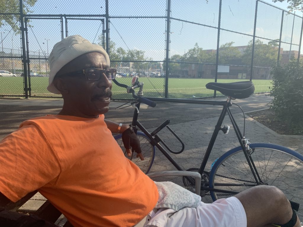Frank Williams sits in the playground where two or more gunmen opened fire at Old Timer's Day in Brownsville on July 27, 2019. Eagle photo by Noah Goldberg