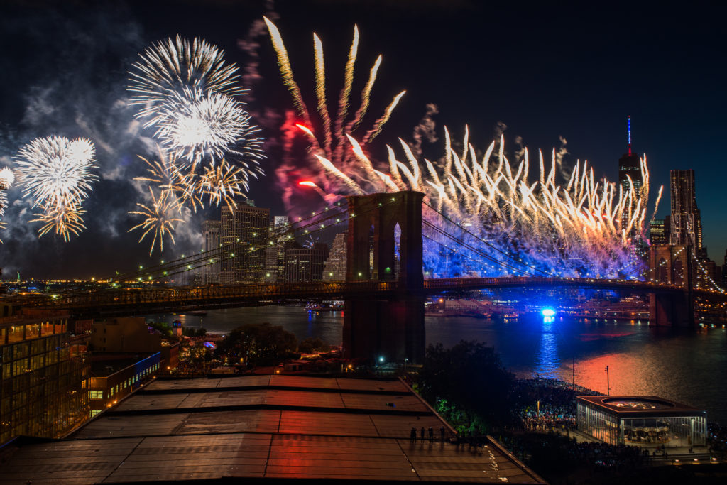 Fireworks are set off from the Brooklyn Bridge. Photo by Julienne Schaer