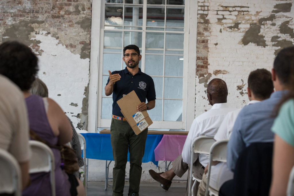 City Councilmember Carlos Menchaca speaks at the community meeting with UPS. Eagle photo by Paul Frangipane