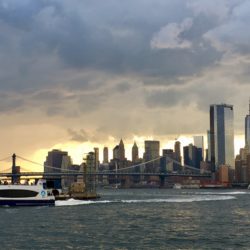 From the boardwalk behind the glass towers of Spitzer Enterprises, you can watch the weather drama across the river in Manhattan.  Eagle photo by Lore Croghan