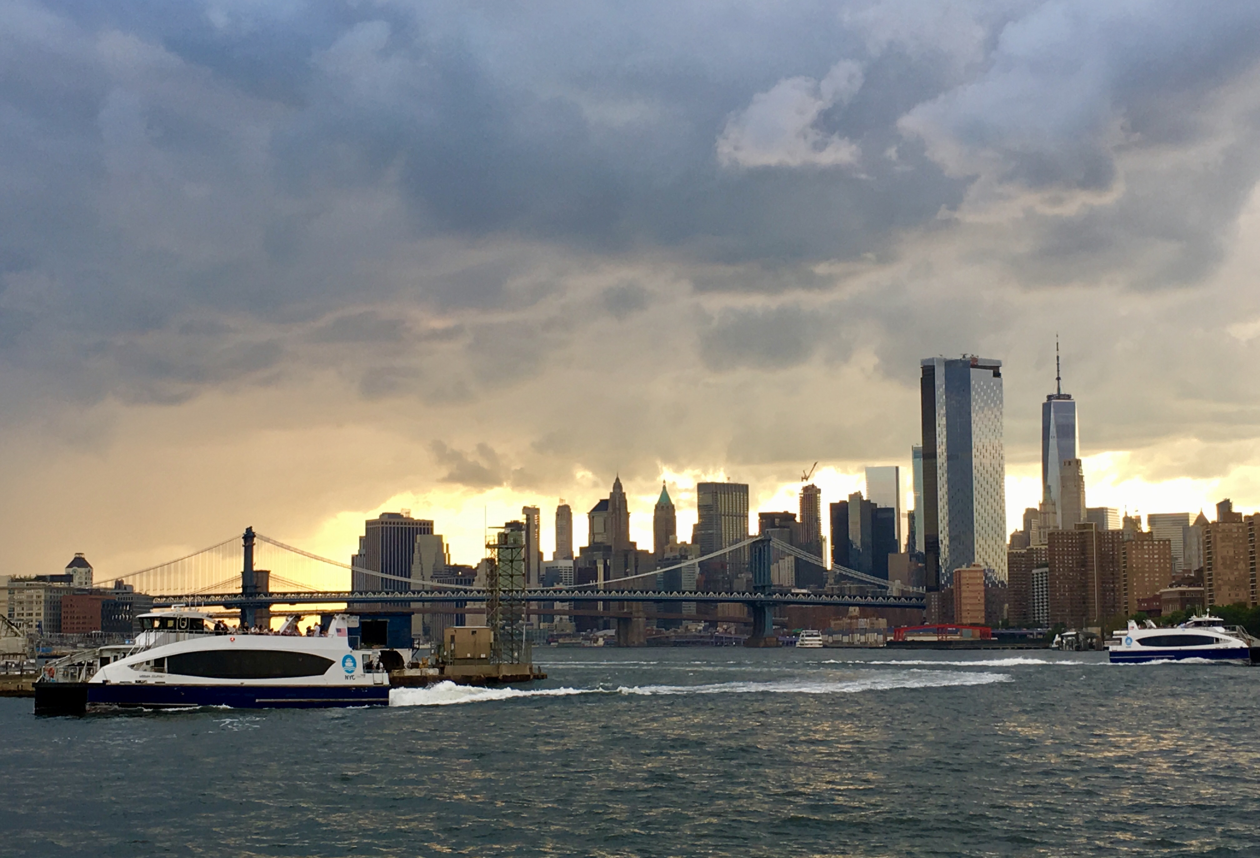From the promenade behind Spitzer Enterprises’ glass towers, you can get an eyeful of weather drama across the river in Manhattan. Eagle photo by Lore Croghan 