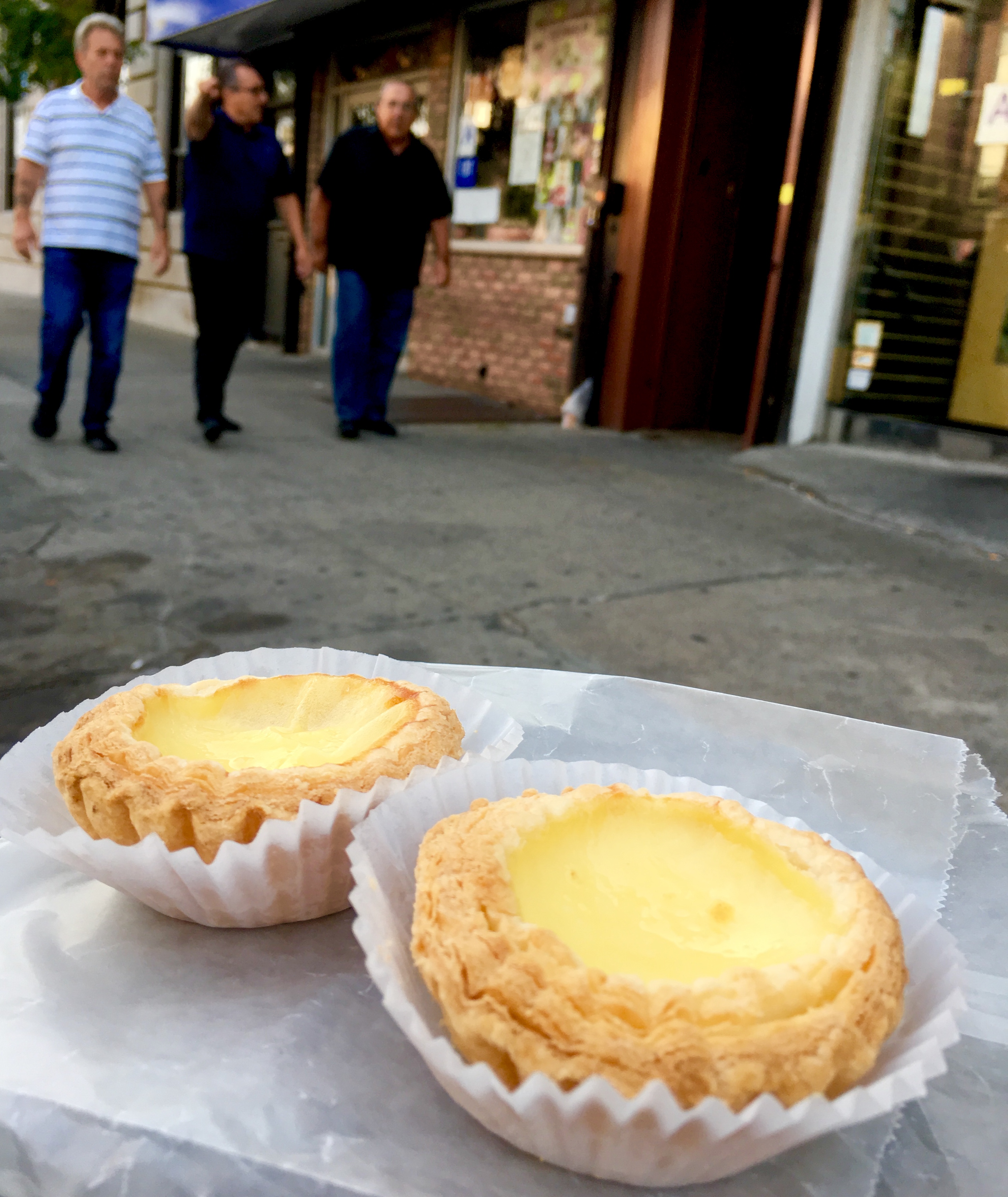These egg custard tarts came from IBakery 18 Inc., which is partly visible in the backdrop of this picture. Eagle photo by Lore Croghan