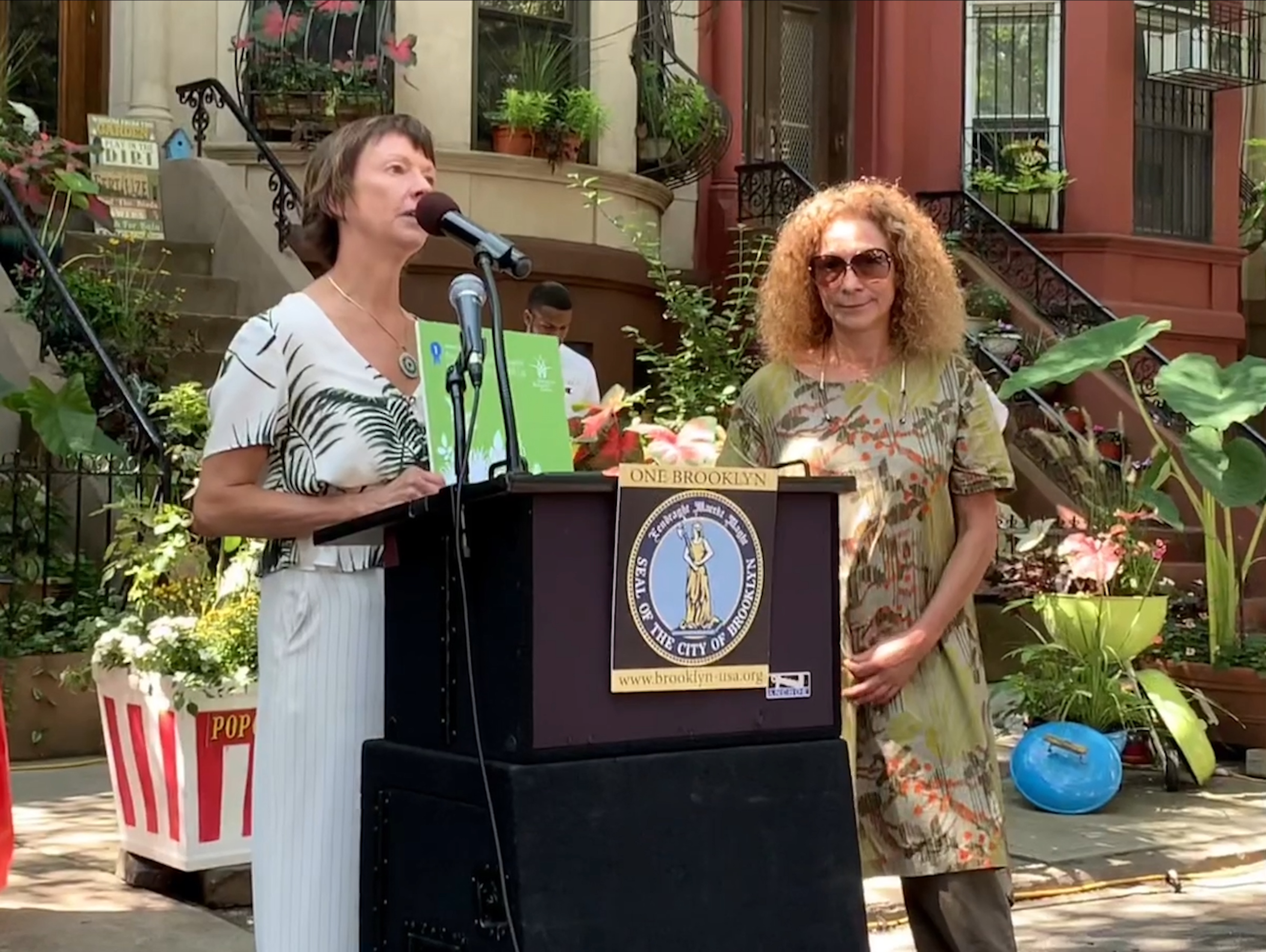 Kate Chura, executive director of the Montague BID, and Estela Johannesen, owner of James Weir Floral, accepted the award for the greenest commercial block, on behalf of the BID. Eagle photo by Mary Frost