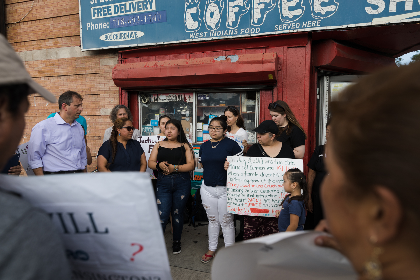 Dozens of family members and friends of María del Carmen Porras Hernández gathered at the corner of Coney Island and Church avenues. Eagle photo by Paul Frangipane