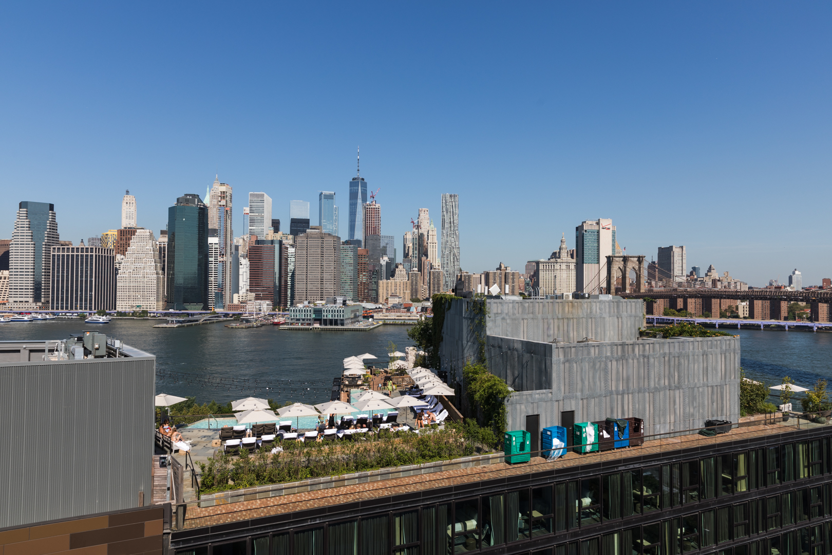 The terrace on 30 Columbia Heights looks over 1 Hotel Brooklyn Bridge’s rooftop pool with lower Manhattan in the background. Eagle photo by Paul Frangipane