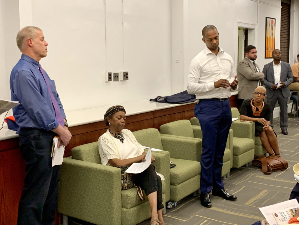 Officials not looking too happy at Wednesday night’s B38 and B54 bus town hall. From left: MTA’s Andrew Inglesby, state Sen. Velmanette Montgomery, Assemblymember Walter Mosley, Councilmember Laurie Cumbo (seated). Eagle photo by Mary Frost