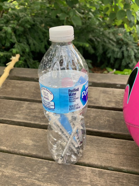 Parents collected the syringes in this plastic water bottle. Photo courtesy of Heather Prince