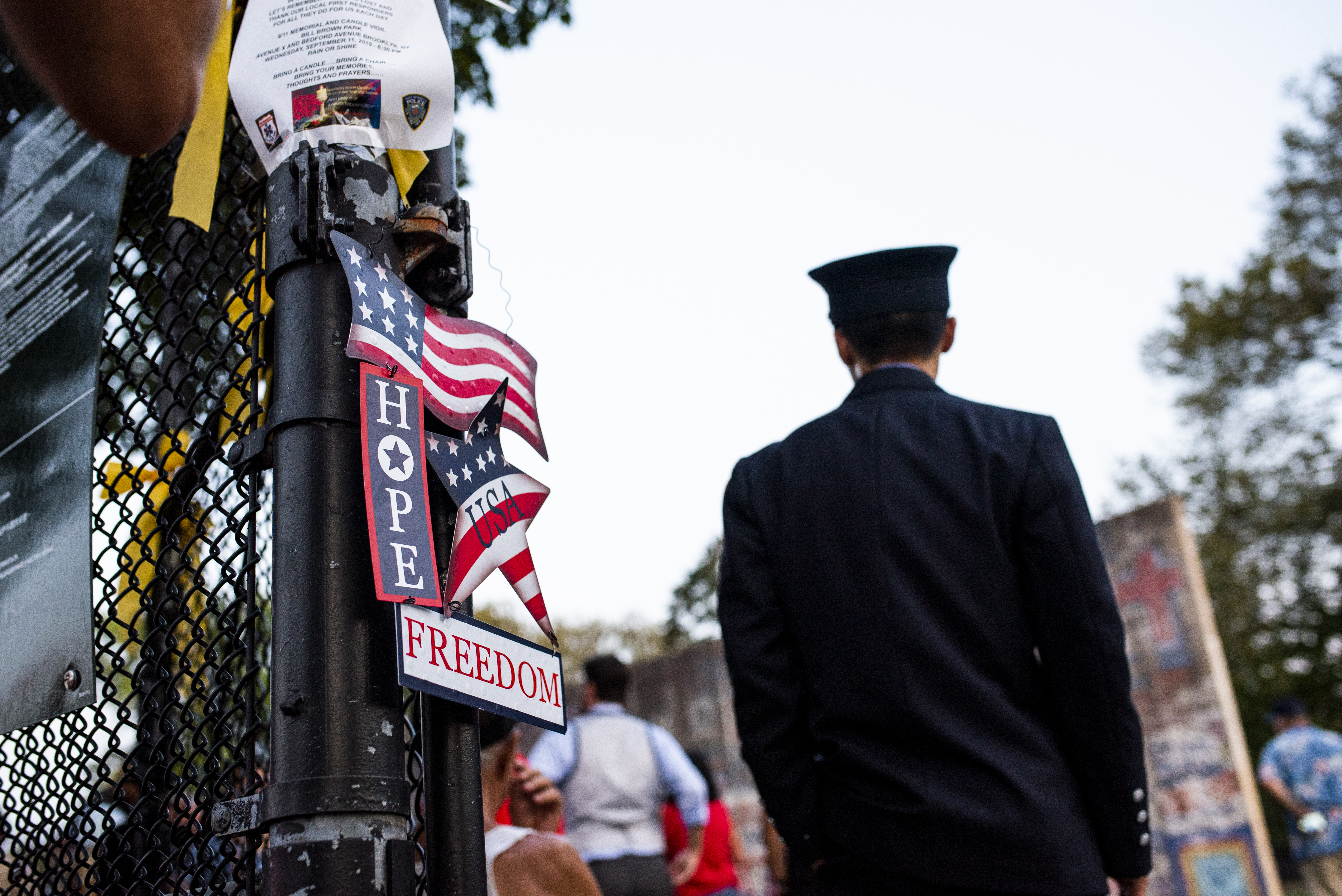 A firefighter heads for the handball court where Sheepshead Bay’s 9/11 memorial is held. Eagle photo by Mark Davis