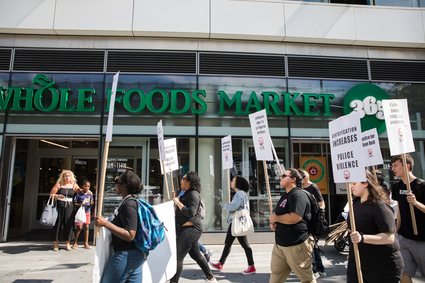 The protesters pass Whole Foods, which opened its Fort Greene store adjacent to an Apple store in January 2018. Eagle photo by Paul Frangipane