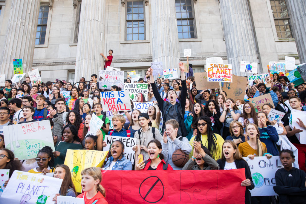 Hundreds of Brooklyn students protested on the steps of Borough Hall to demand global government take action against climate change.