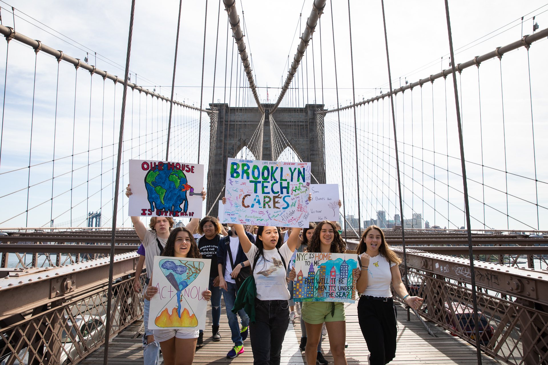 Students march over the Brooklyn Bridge while making their voices heard.