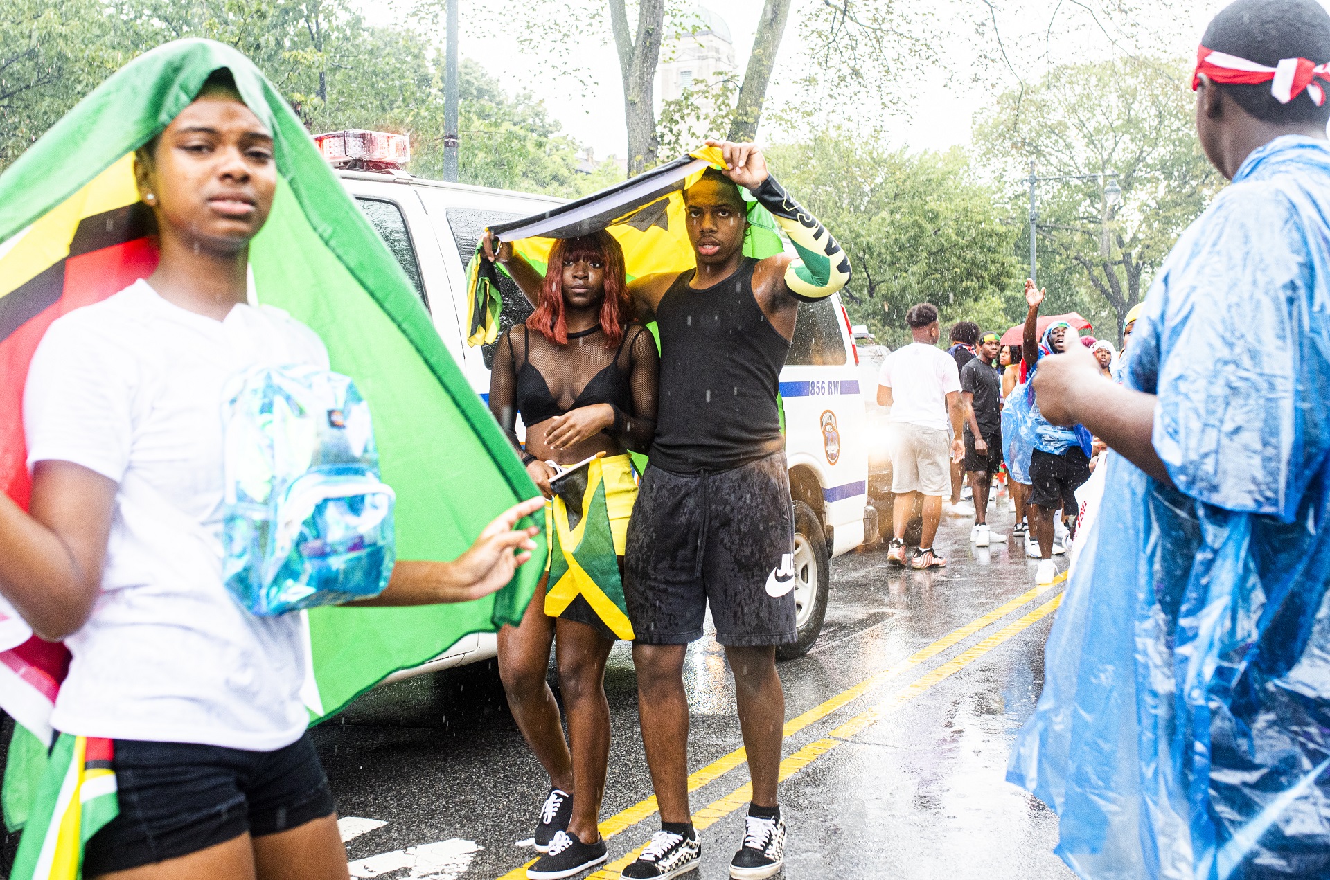 Parade participants sought cover while making their way down Eastern Parkway.