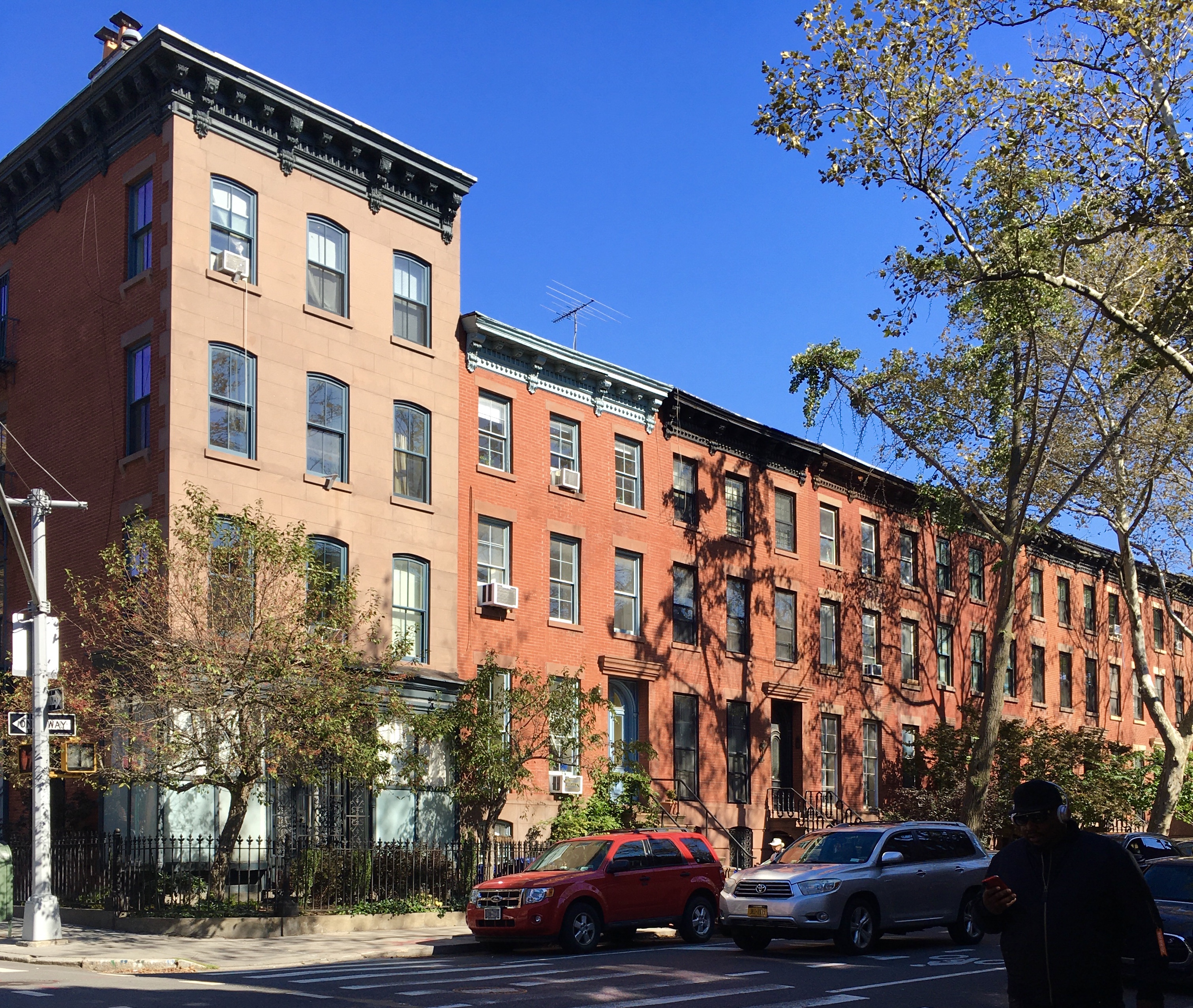 Trees cast shadows on 133 Bergen St. (at left) and other houses on this lovely landmarked Boerum Hill block. Eagle photo by Lore Croghan