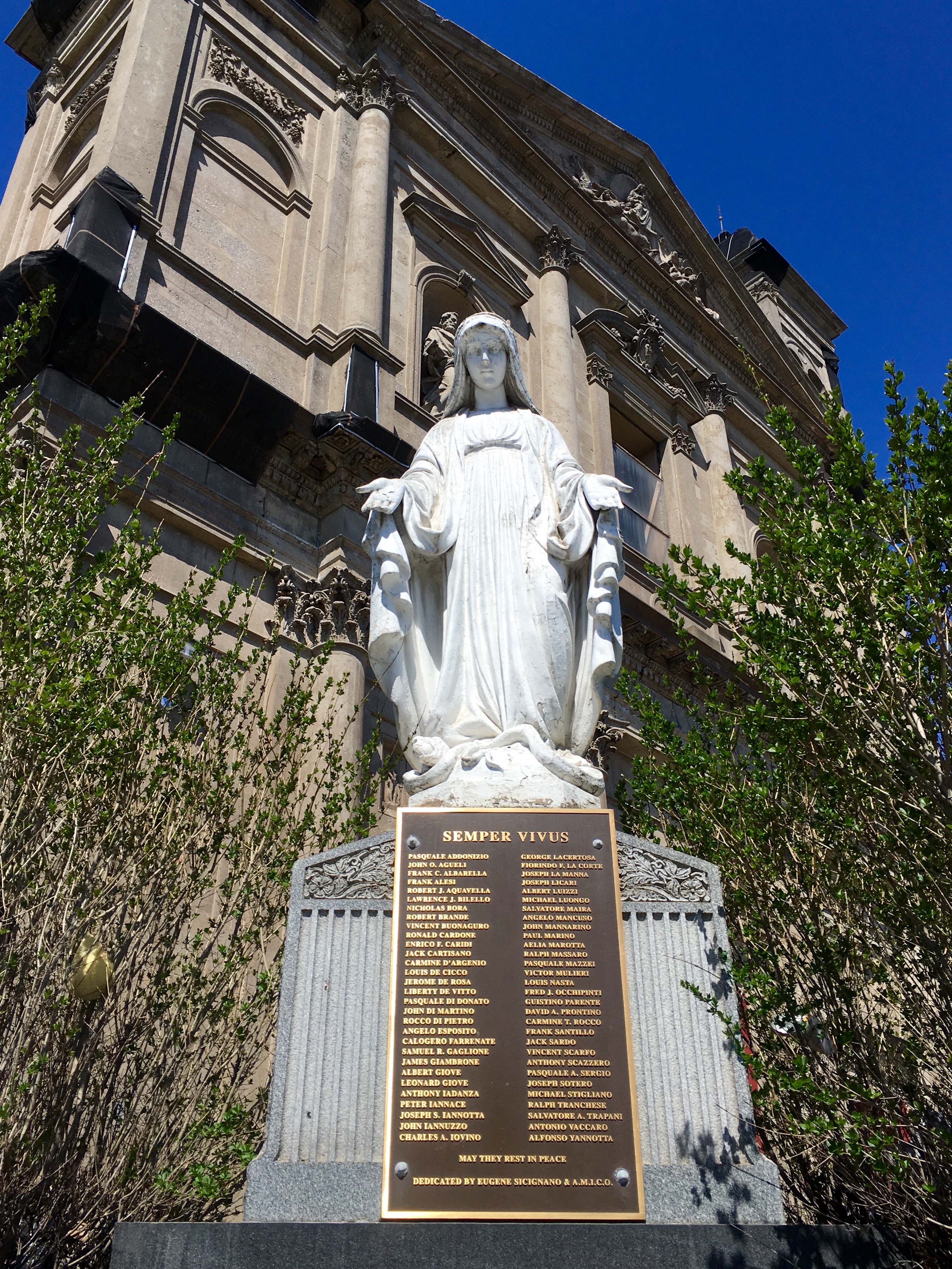 This statue and war memorial stood outside Our Lady of Loreto. Eagle file photo by Lore Croghan