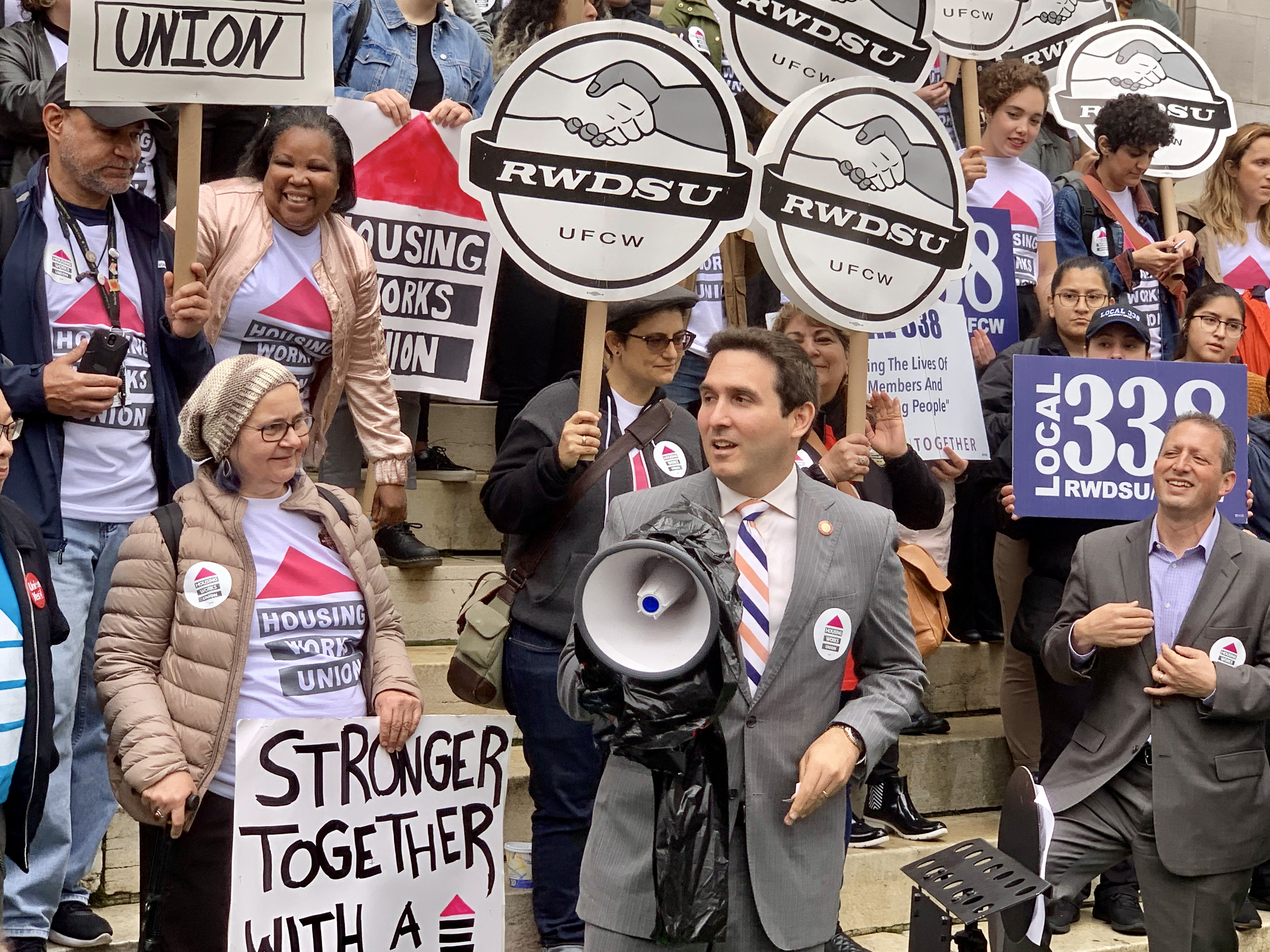 Councilmember Ben Kallos, center, and Councilmember Brad Lander to the right, at the Housing Works employee rally. Eagle photo by Mary Frost