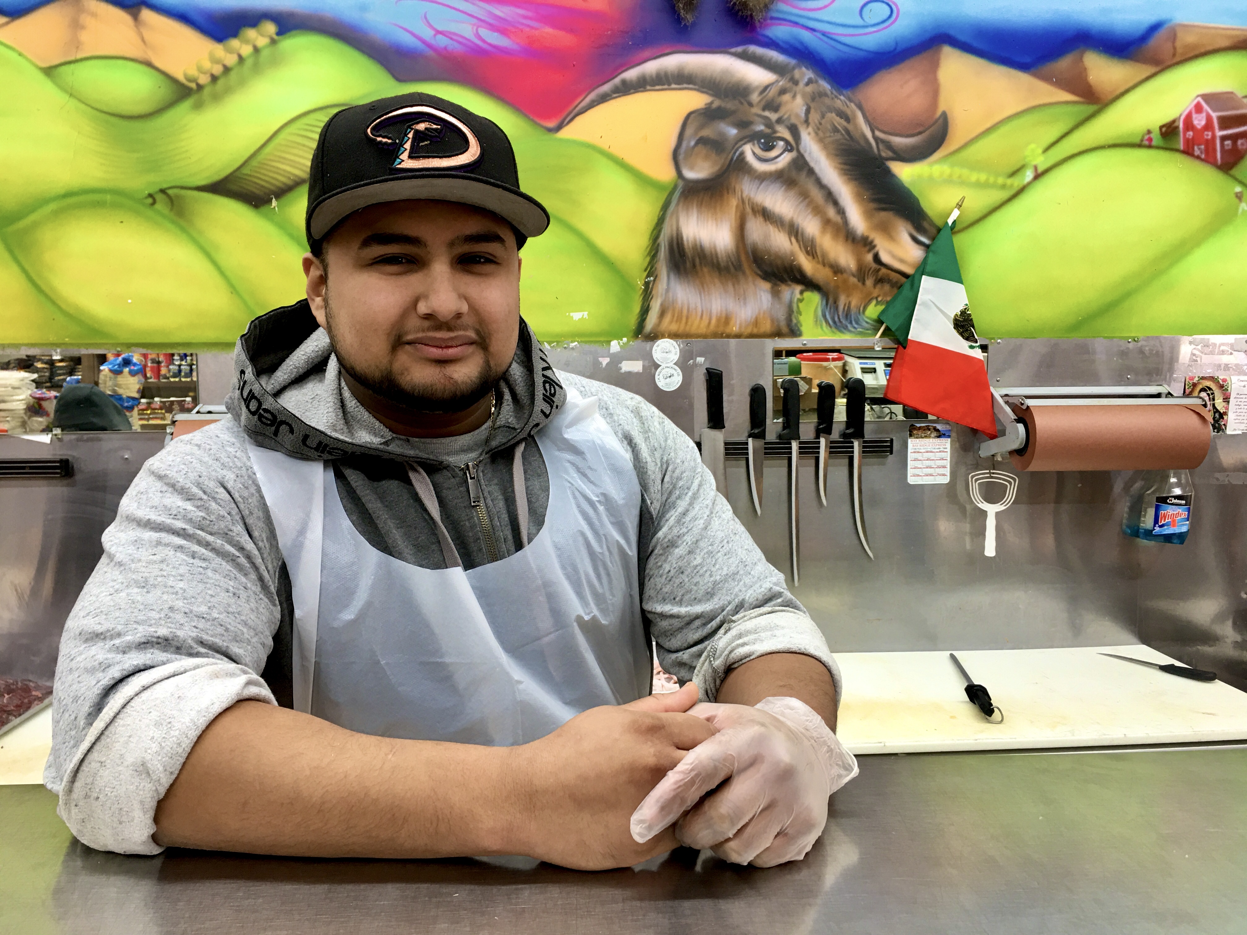 Nelson Hernandez is a butcher at El Rancho Nuevo Supermarket. Photo: Lore Croghan/Brooklyn Eagle