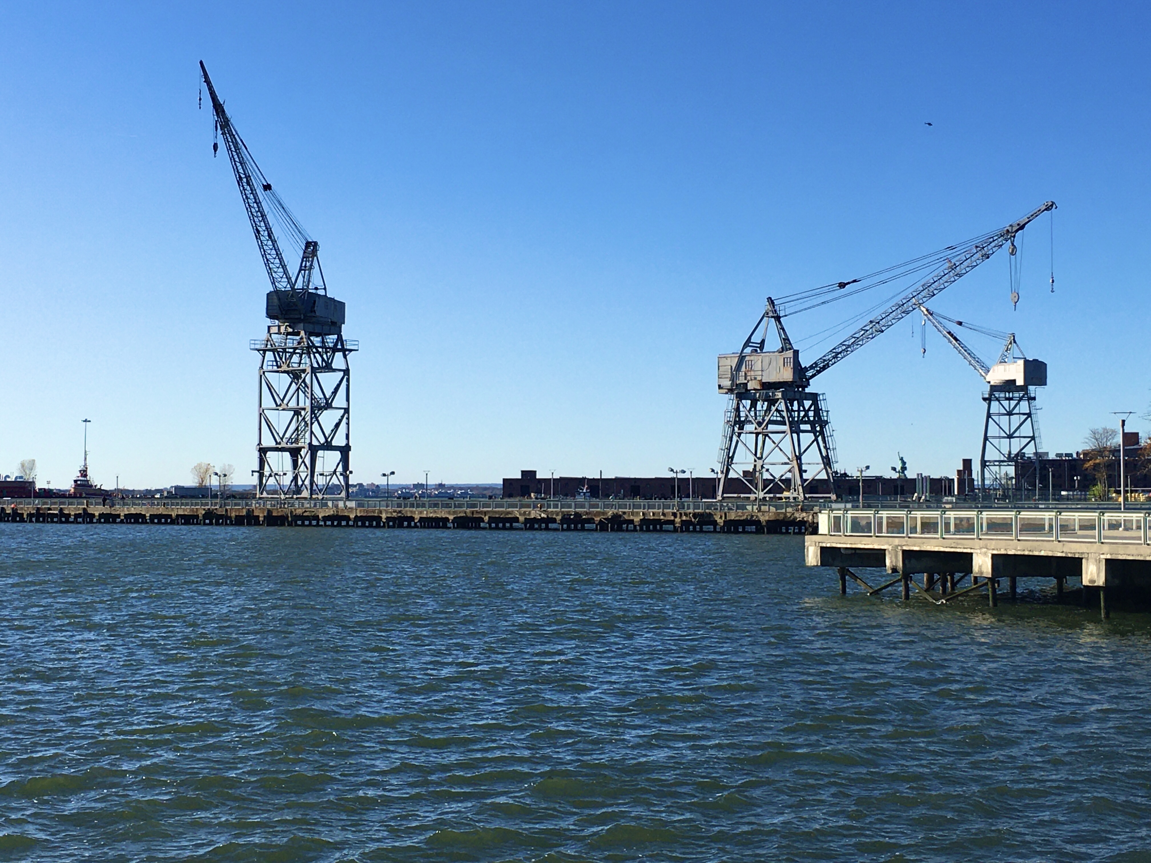 Gantry cranes add drama to the horizon at Erie Basin Park. Eagle photo by Lore Croghan