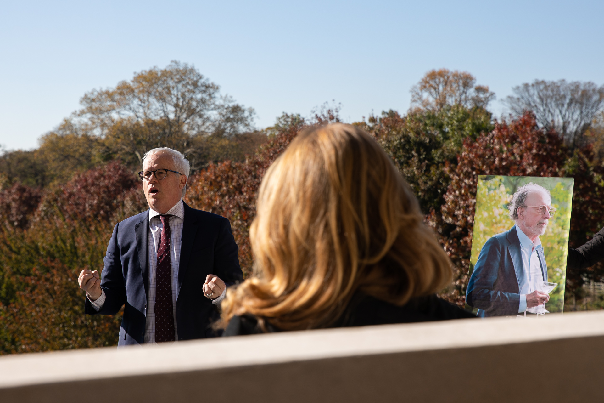 Brooklyn Botanic Garden President Scot Medbury (at left) says the late Robert W. Wilson (whose photo is on an easel at right) was a BBG supporter for a half-century. Eagle photo by Paul Frangipane