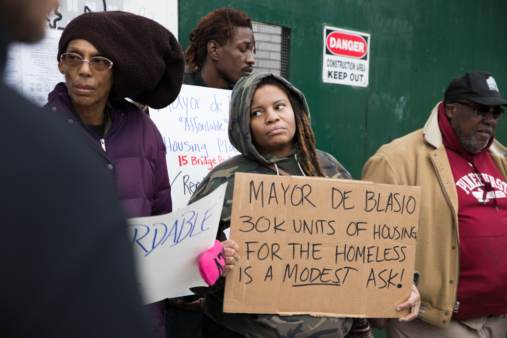 Charisma White, center, was homeless for three years before securing housing in Sunset Park. “I’m not understanding why they’re putting up new developments that the people in the neighborhood can’t utilize," she said. Photo: Paul Frangipane/Brooklyn Eagle