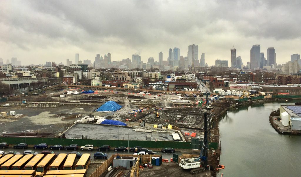 The land along the canal and across the street from the parked buses is the Public Place site where the Gowanus Green development is planned. Photo: Lore Croghan/Brooklyn Eagle