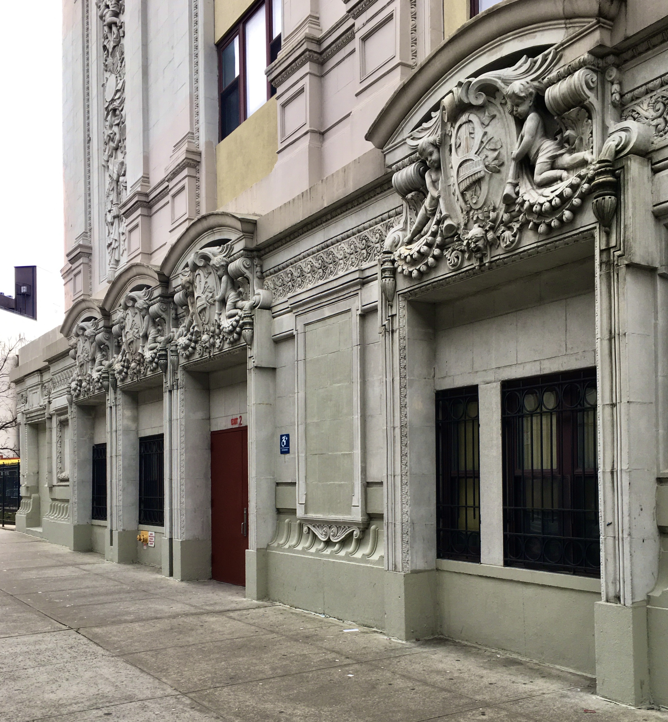 Cherubs line up on the facade of the former Bushwick Theatre, which is now the Brooklyn High School for Law and Technology. Photo: Lore Croghan/Brooklyn Eagle