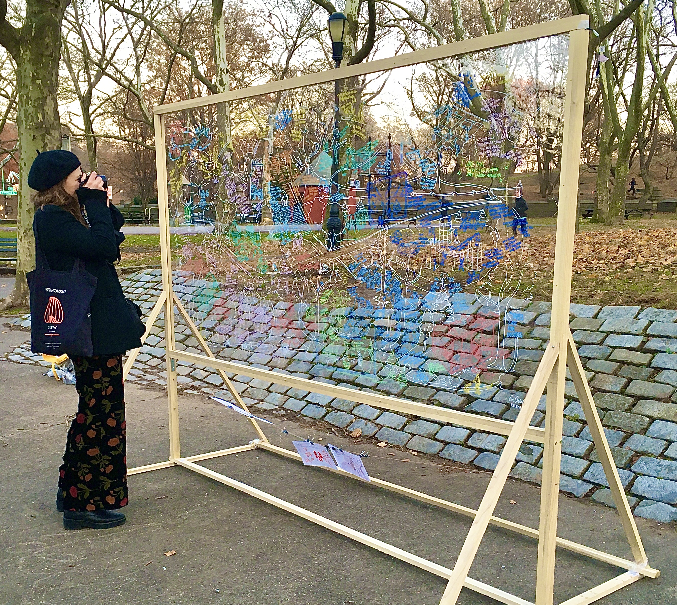 Royal College of Art student Sophie Horrocks snaps photos of Eva Oosterlaken’s Fort Greene Park art installation. Photo: Lore Croghan/Brooklyn Eagle