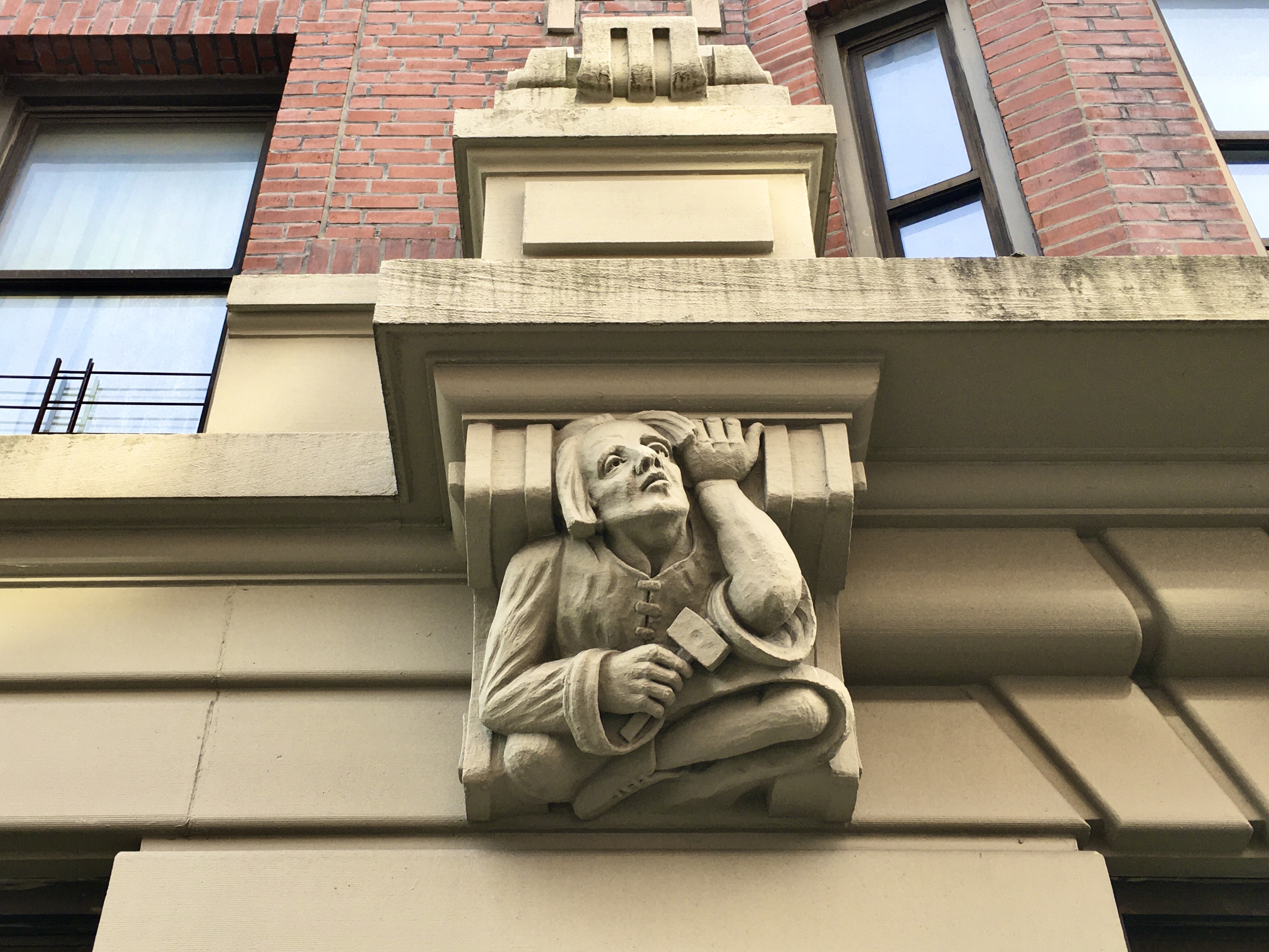 This dour fellow can be found on the facade of the Royal Castle Apartments. Photo: Lore Croghan/Brooklyn Eagle