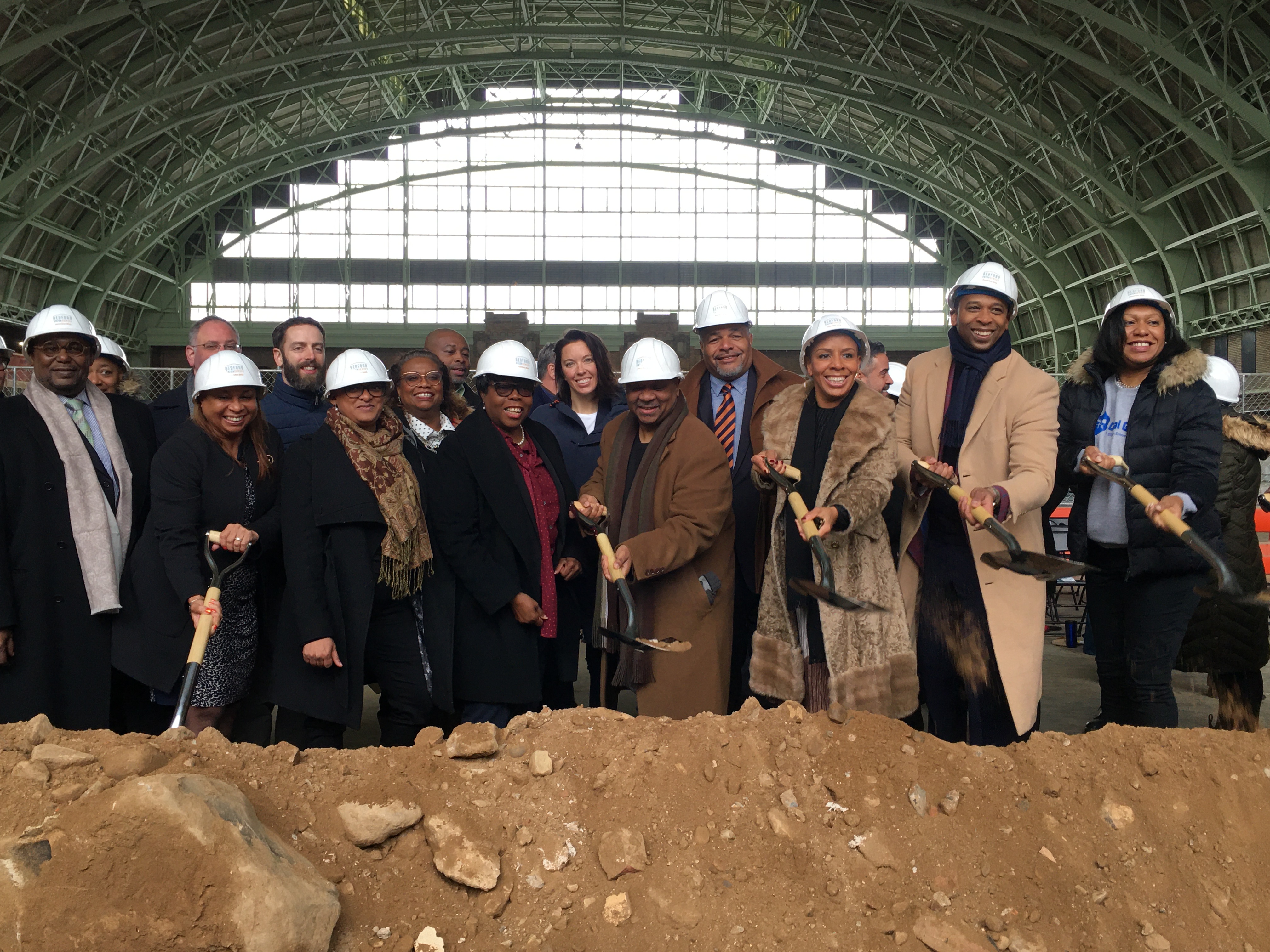City Council Majority Leader Laurie Cumbo (third from right) holds a ceremonial shovel at the Bedford Union Armory’s ground-breaking. Photo: Lore Croghan/Brooklyn Eagle